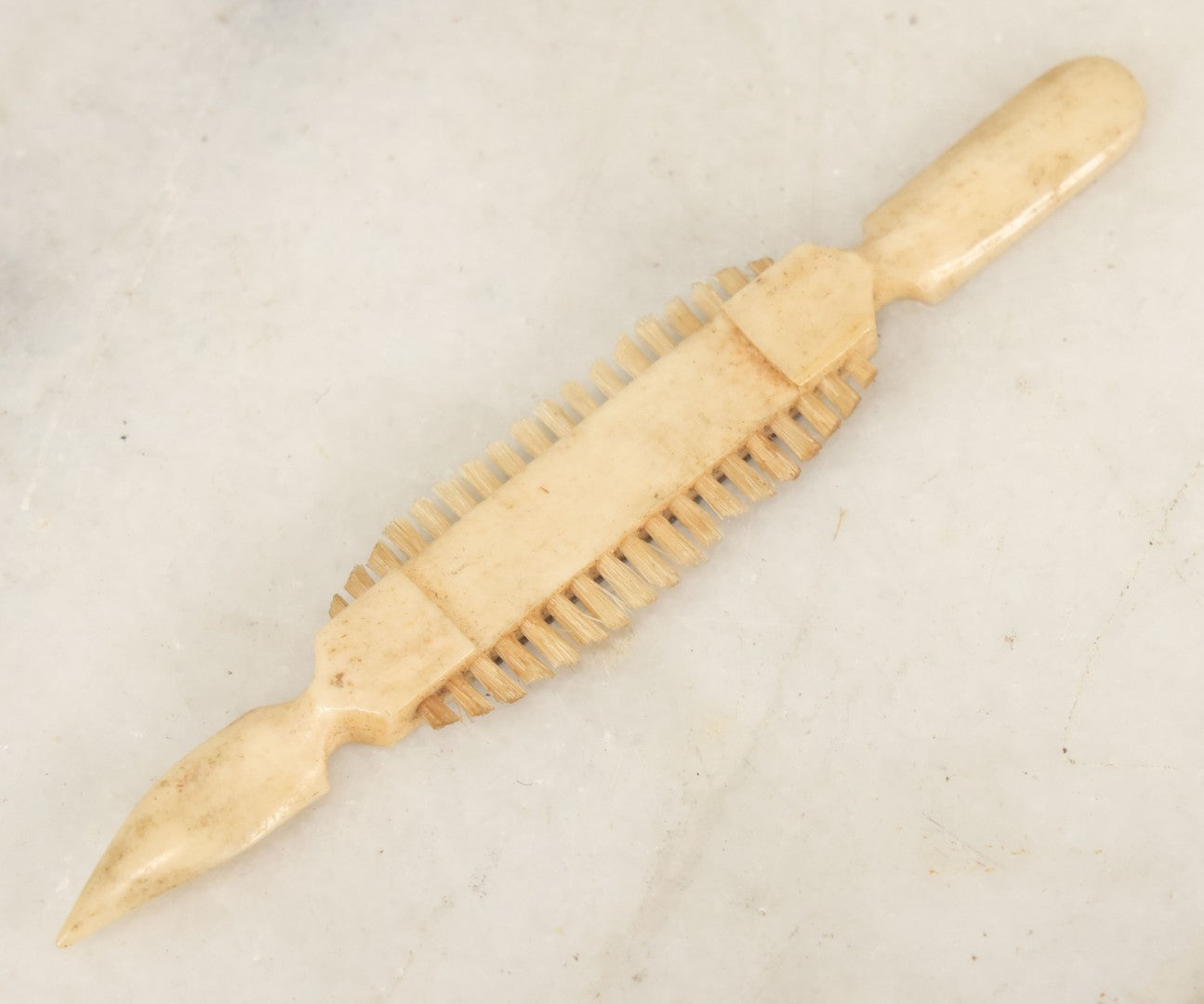 Lot 048 - Antique Carved Scrimshaw Bone Multi-Tool With Brush And Blade, Early Grooming Or Cleaning Implement