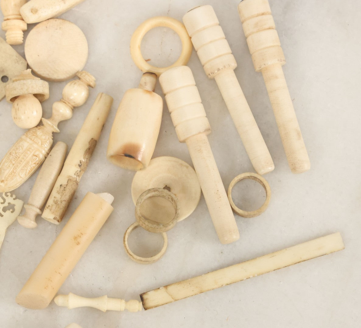 Lot 059 - Grouping Of Antique And Vintage Bone Fragments, Chess Pieces, Rings, Spindles, And Miscellaneous Items, 20+ Pieces