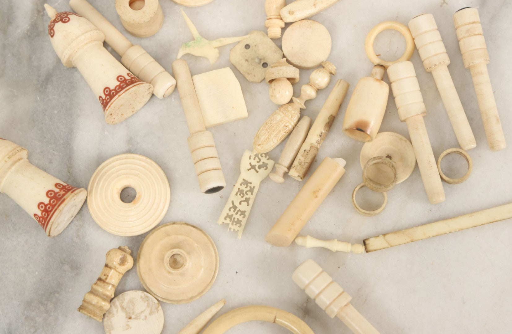 Lot 059 - Grouping Of Antique And Vintage Bone Fragments, Chess Pieces, Rings, Spindles, And Miscellaneous Items, 20+ Pieces