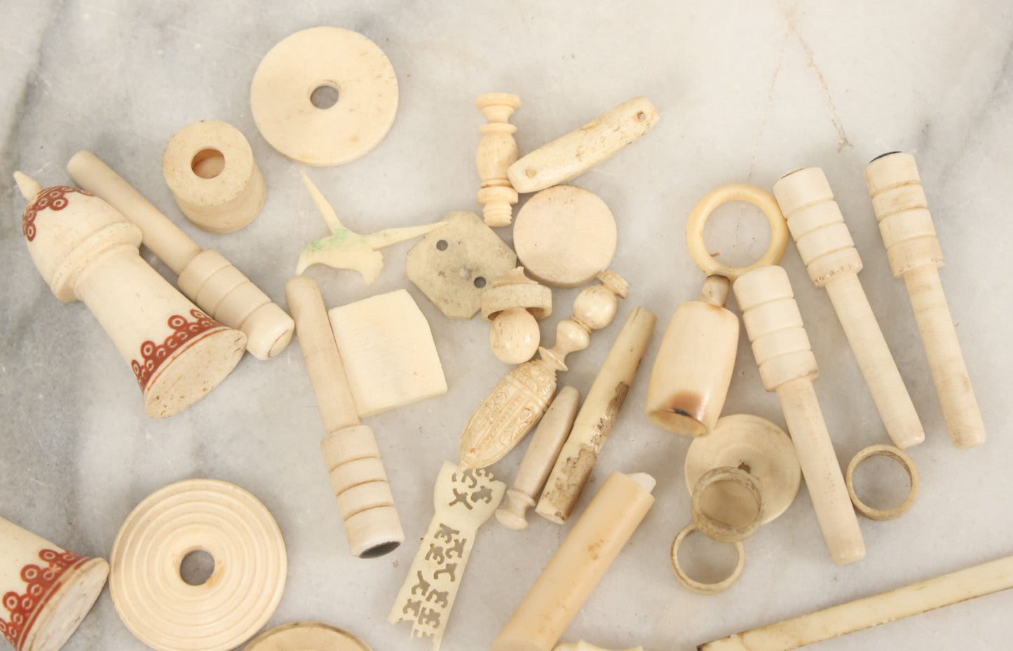 Lot 059 - Grouping Of Antique And Vintage Bone Fragments, Chess Pieces, Rings, Spindles, And Miscellaneous Items, 20+ Pieces