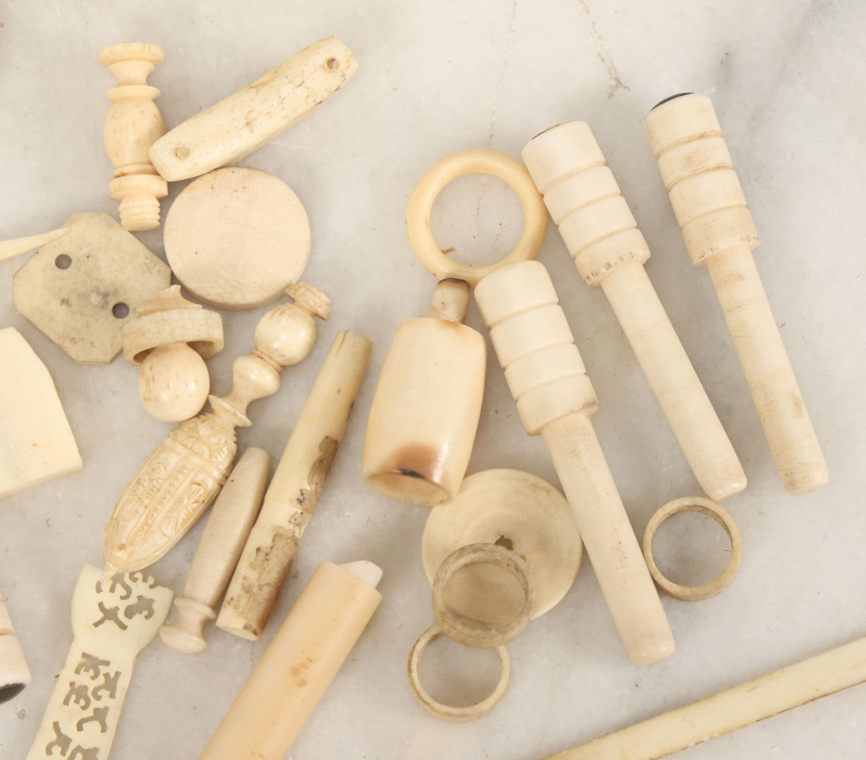 Lot 059 - Grouping Of Antique And Vintage Bone Fragments, Chess Pieces, Rings, Spindles, And Miscellaneous Items, 20+ Pieces