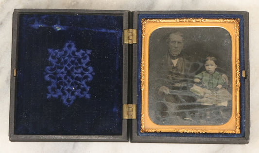 Lot 081 - Antique 1/6th Plate Tintype Photograph Of A Grandfather And Grand Daughter In Hand Tinted Green Dress, In Thermoplastic Union Case With Naval Ship Motif, Flag