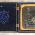 Lot 081 - Antique 1/6th Plate Tintype Photograph Of A Grandfather And Grand Daughter In Hand Tinted Green Dress, In Thermoplastic Union Case With Naval Ship Motif, Flag