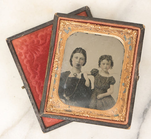 Lot 082 - Antique 1/6th Plate Tintype Photograph Of A Mother And Her Curly Haired Daughter, In Full Split Leatherette Union Case