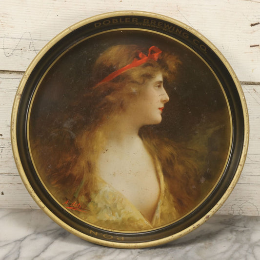 Lot 100 - Vintage Dobler Brewing Company Tin Lithograph Beer Tray With Beautiful Woman, Albany, New York, After A. Asti, 13-1/4" Diameter