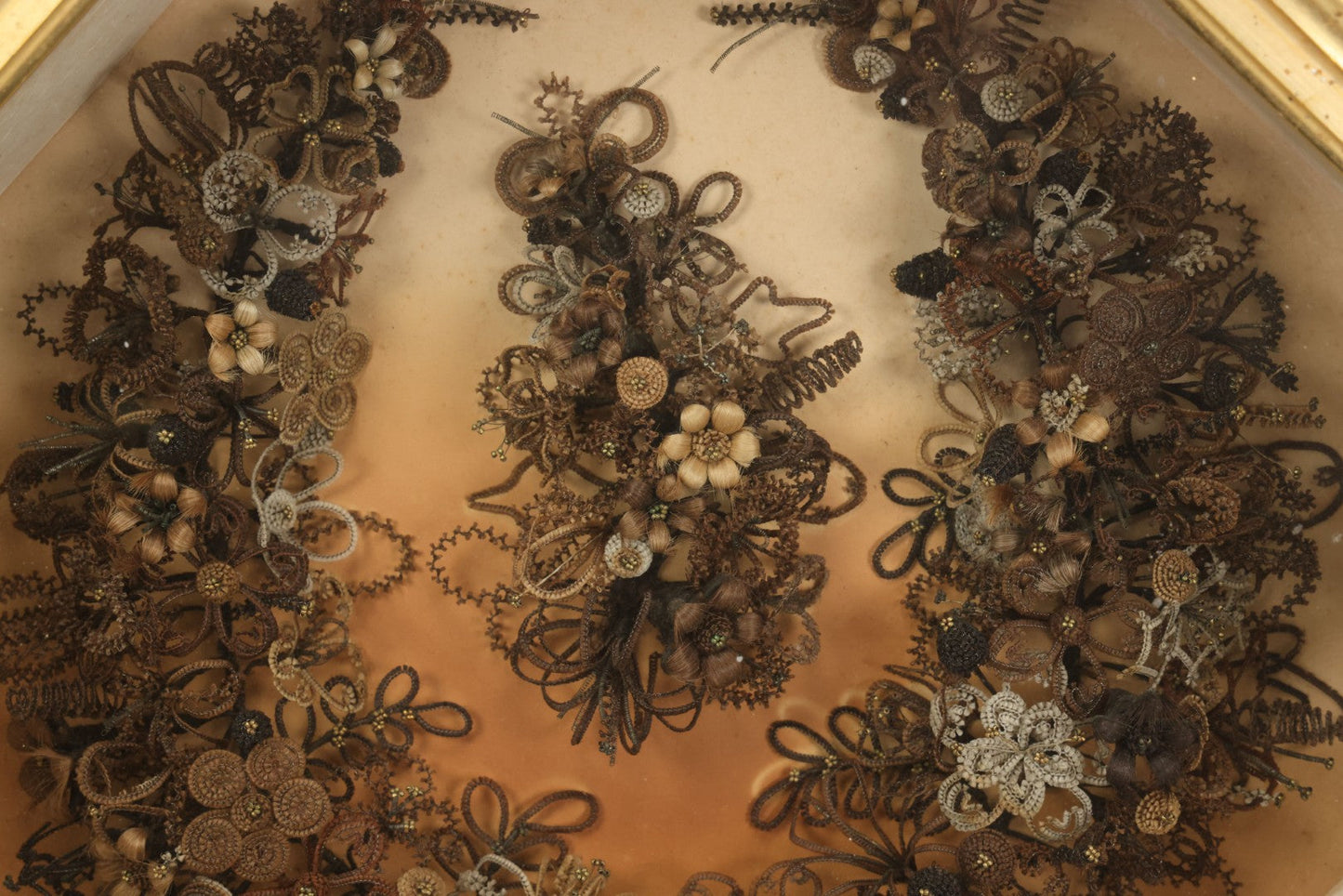 Lot 001 - Antique Victorian Human Hair Work Wreath In Octagon Shadow Box With Paper Label From J.D. Powers' Photograph Rooms, Springfield, Vermont, 20" x 20" x 6"