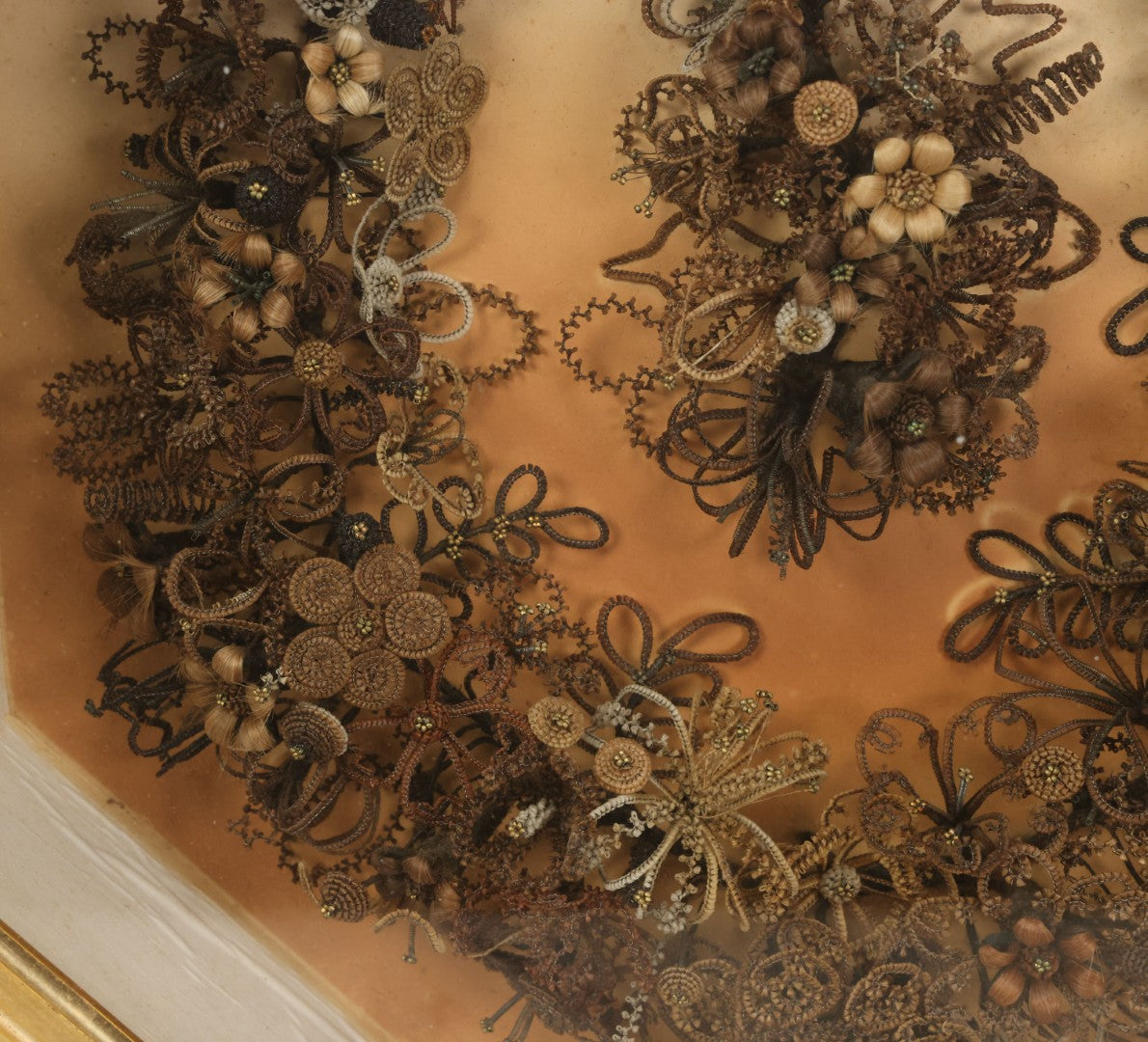 Lot 001 - Antique Victorian Human Hair Work Wreath In Octagon Shadow Box With Paper Label From J.D. Powers' Photograph Rooms, Springfield, Vermont, 20" x 20" x 6"