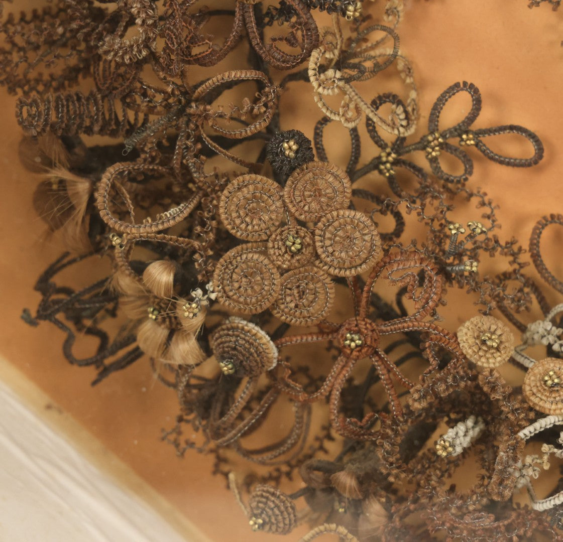 Lot 001 - Antique Victorian Human Hair Work Wreath In Octagon Shadow Box With Paper Label From J.D. Powers' Photograph Rooms, Springfield, Vermont, 20" x 20" x 6"