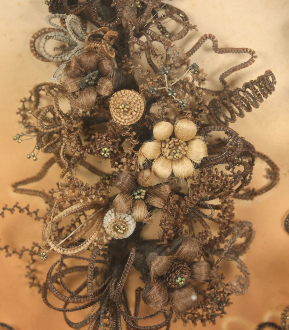 Lot 001 - Antique Victorian Human Hair Work Wreath In Octagon Shadow Box With Paper Label From J.D. Powers' Photograph Rooms, Springfield, Vermont, 20" x 20" x 6"