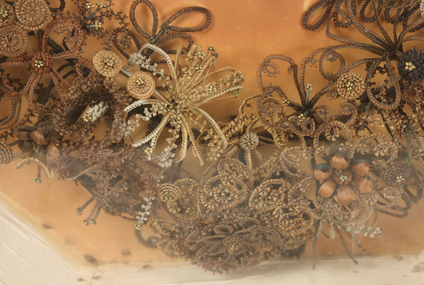 Lot 001 - Antique Victorian Human Hair Work Wreath In Octagon Shadow Box With Paper Label From J.D. Powers' Photograph Rooms, Springfield, Vermont, 20" x 20" x 6"