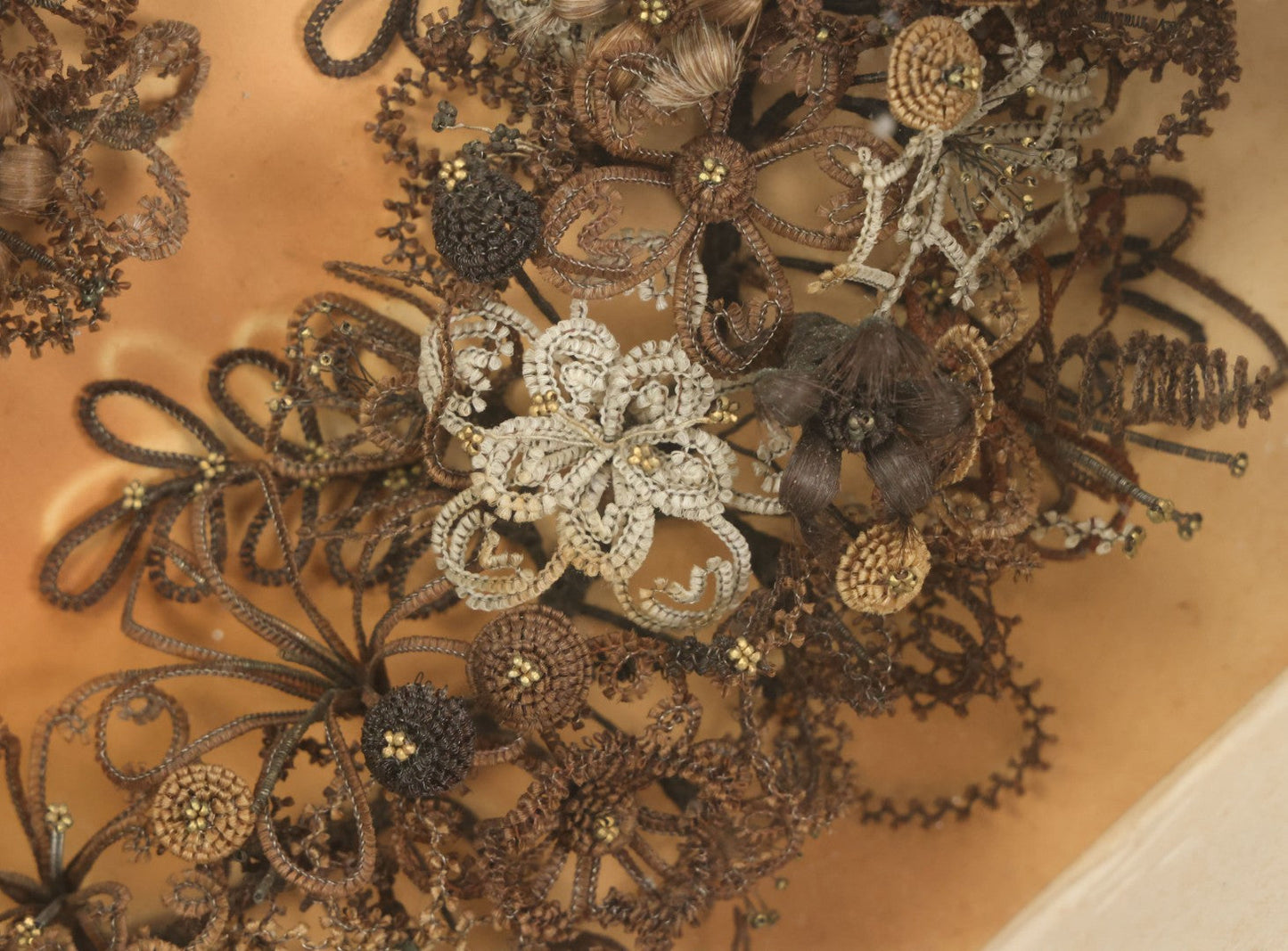 Lot 001 - Antique Victorian Human Hair Work Wreath In Octagon Shadow Box With Paper Label From J.D. Powers' Photograph Rooms, Springfield, Vermont, 20" x 20" x 6"