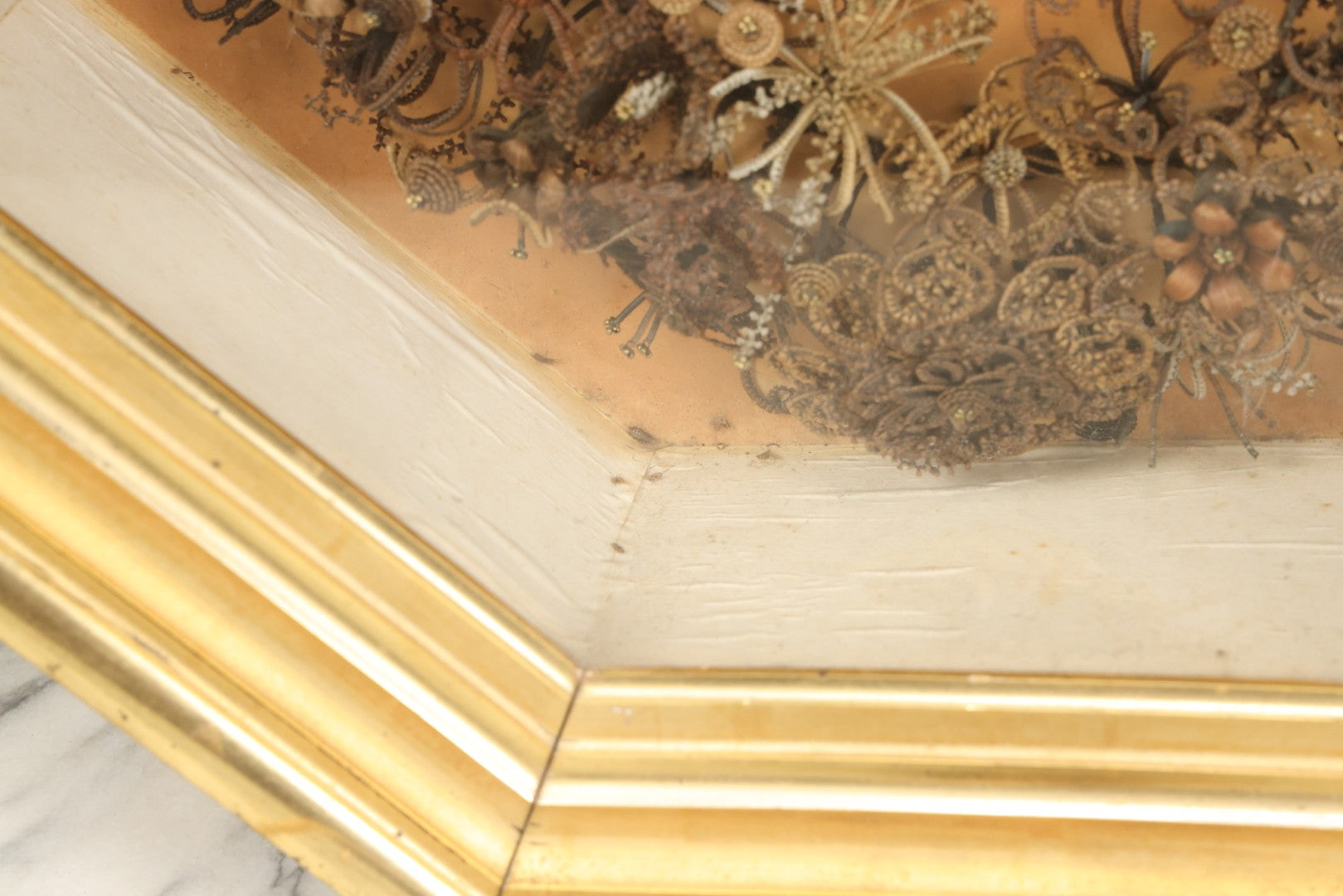 Lot 001 - Antique Victorian Human Hair Work Wreath In Octagon Shadow Box With Paper Label From J.D. Powers' Photograph Rooms, Springfield, Vermont, 20" x 20" x 6"