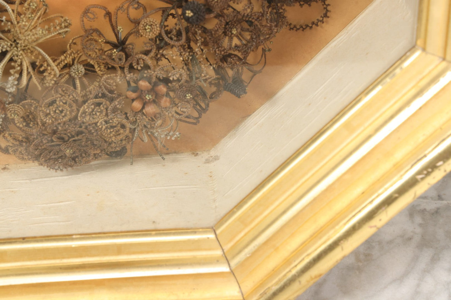 Lot 001 - Antique Victorian Human Hair Work Wreath In Octagon Shadow Box With Paper Label From J.D. Powers' Photograph Rooms, Springfield, Vermont, 20" x 20" x 6"