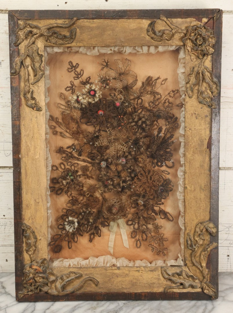 Lot 002 - Antique Victorian Human Hair Work Shadowbox In Ornate Gesso Frame With Bow Designs, Ruffled Surround, Many Beaded Embellishments, 14-5/8" x 20-1/2" x 2-1/2"