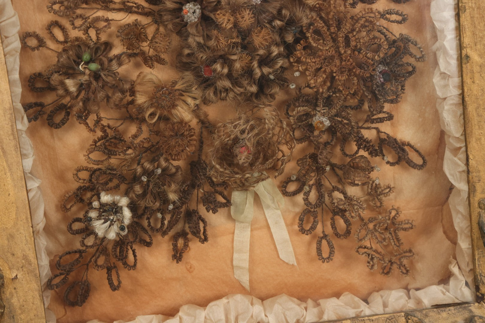 Lot 002 - Antique Victorian Human Hair Work Shadowbox In Ornate Gesso Frame With Bow Designs, Ruffled Surround, Many Beaded Embellishments, 14-5/8" x 20-1/2" x 2-1/2"