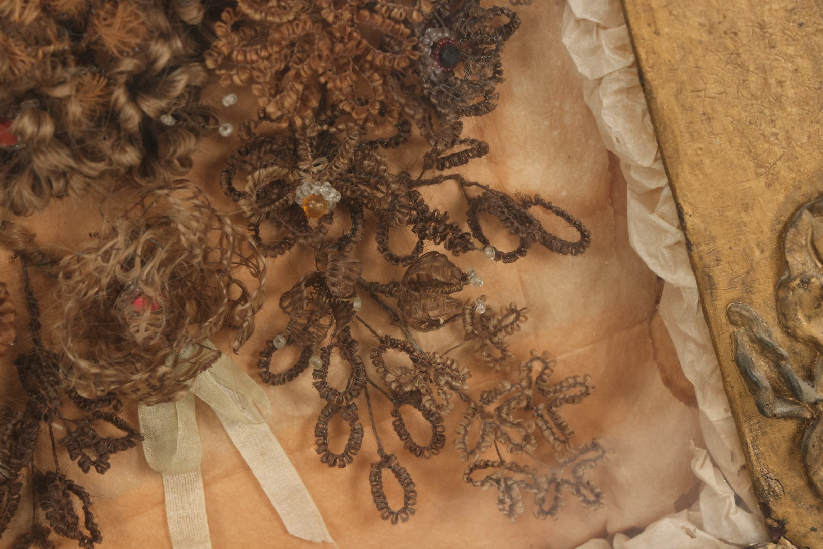 Lot 002 - Antique Victorian Human Hair Work Shadowbox In Ornate Gesso Frame With Bow Designs, Ruffled Surround, Many Beaded Embellishments, 14-5/8" x 20-1/2" x 2-1/2"