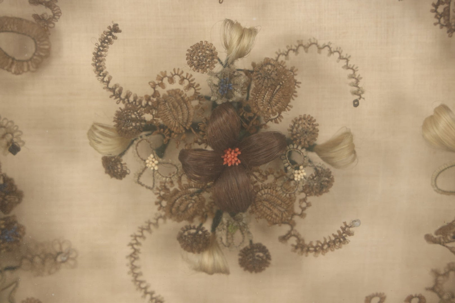 Lot 004 - Antique Victorian Human Hair Work Circular Wreath In Rectangular Shadow Box With Hair Flowers At Center, Fabric Backing, 23-1/8" x 25" x 4-1/2"