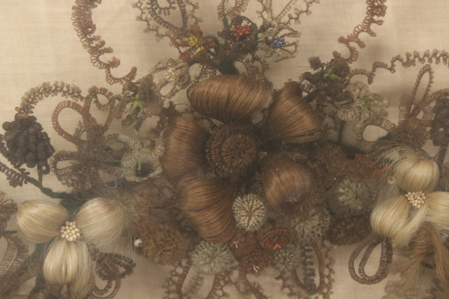 Lot 004 - Antique Victorian Human Hair Work Circular Wreath In Rectangular Shadow Box With Hair Flowers At Center, Fabric Backing, 23-1/8" x 25" x 4-1/2"