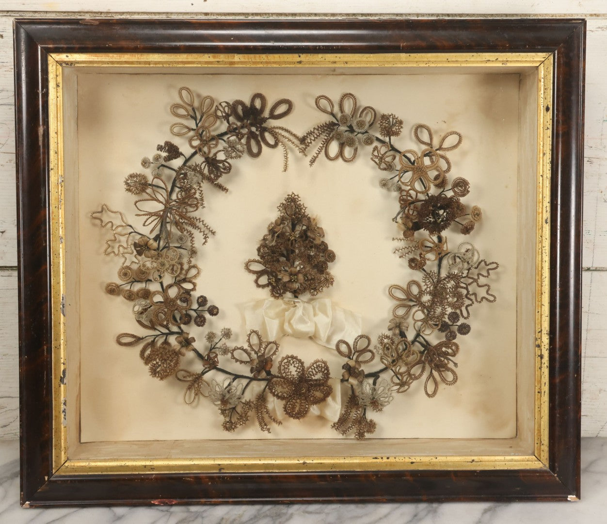 Lot 005 - Antique Victorian Human Hair Work Wreath In Rectangular Shadow Box With White Bow, Center Hair Flower Bouquet, 23-3/4" x 20-3/8" x 3-1/2"