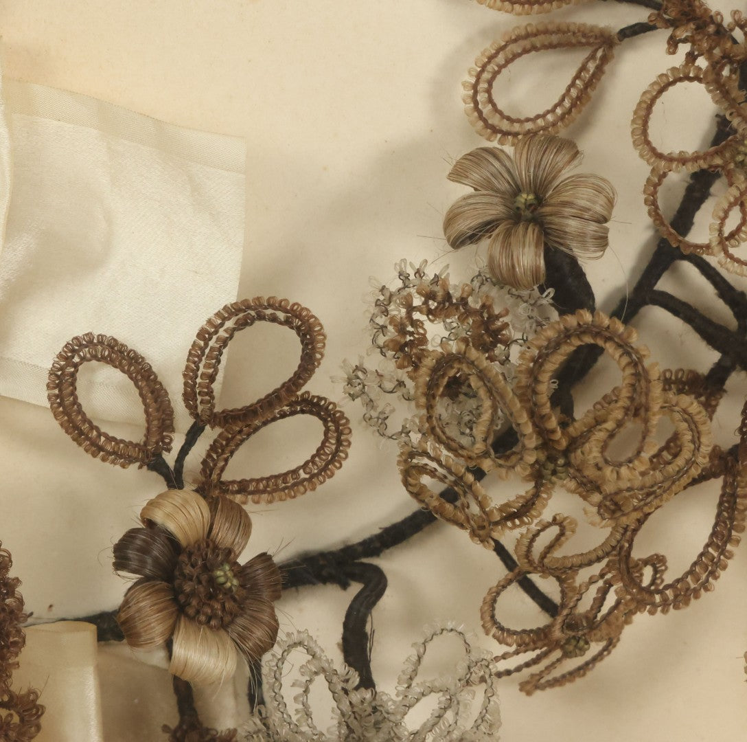 Lot 005 - Antique Victorian Human Hair Work Wreath In Rectangular Shadow Box With White Bow, Center Hair Flower Bouquet, 23-3/4" x 20-3/8" x 3-1/2"