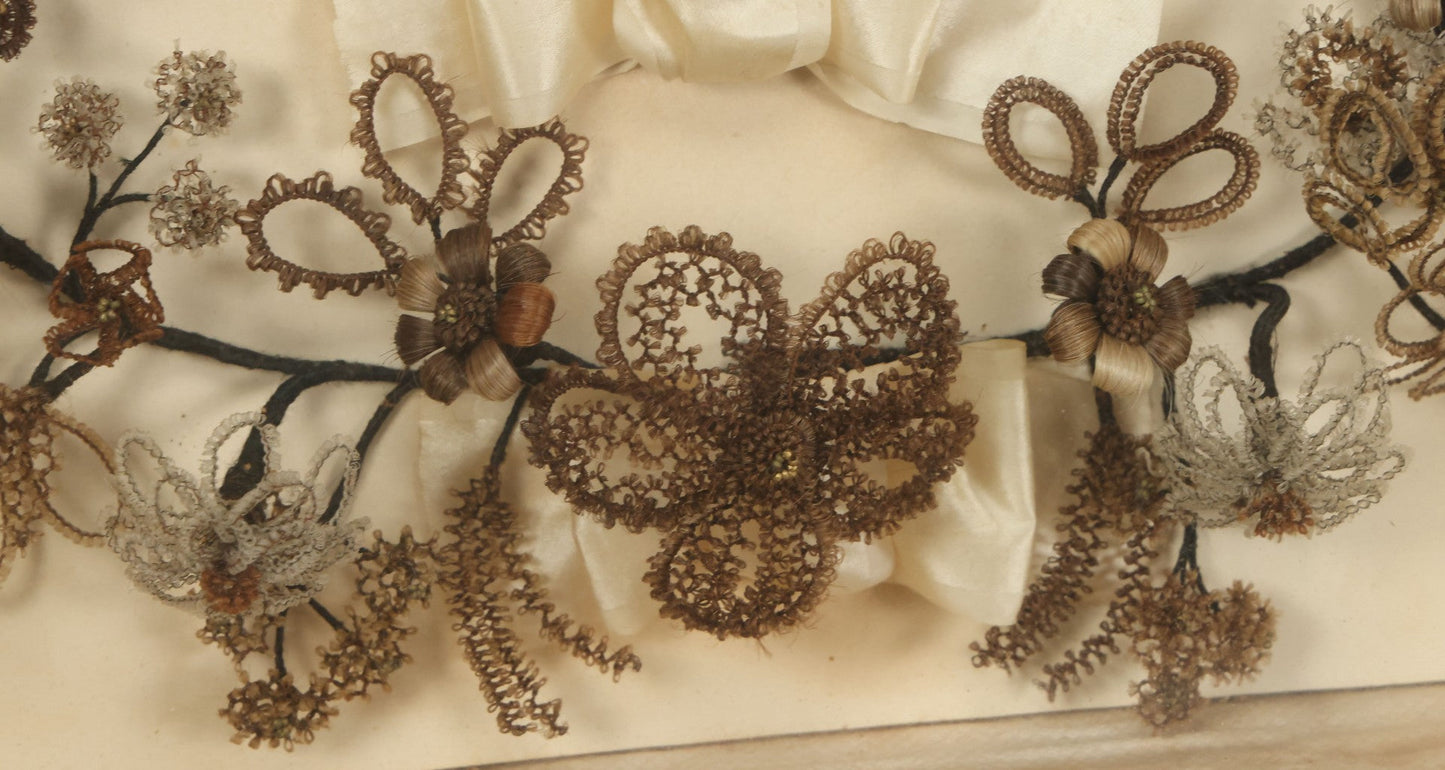 Lot 005 - Antique Victorian Human Hair Work Wreath In Rectangular Shadow Box With White Bow, Center Hair Flower Bouquet, 23-3/4" x 20-3/8" x 3-1/2"