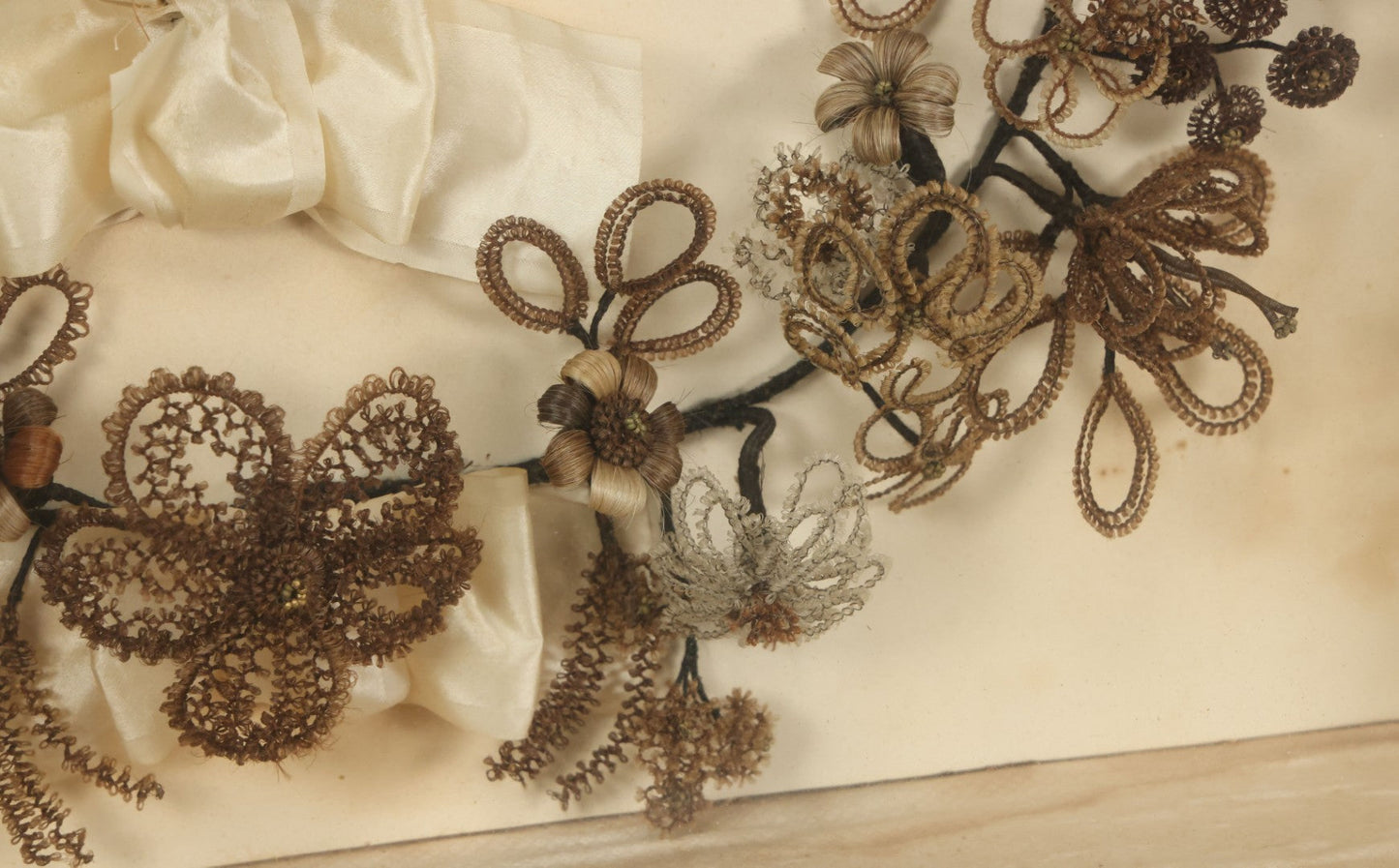 Lot 005 - Antique Victorian Human Hair Work Wreath In Rectangular Shadow Box With White Bow, Center Hair Flower Bouquet, 23-3/4" x 20-3/8" x 3-1/2"