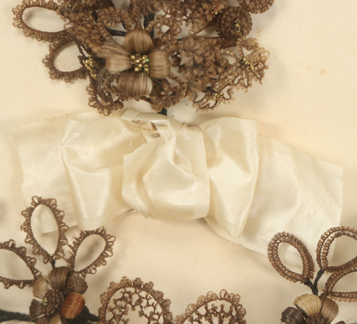 Lot 005 - Antique Victorian Human Hair Work Wreath In Rectangular Shadow Box With White Bow, Center Hair Flower Bouquet, 23-3/4" x 20-3/8" x 3-1/2"