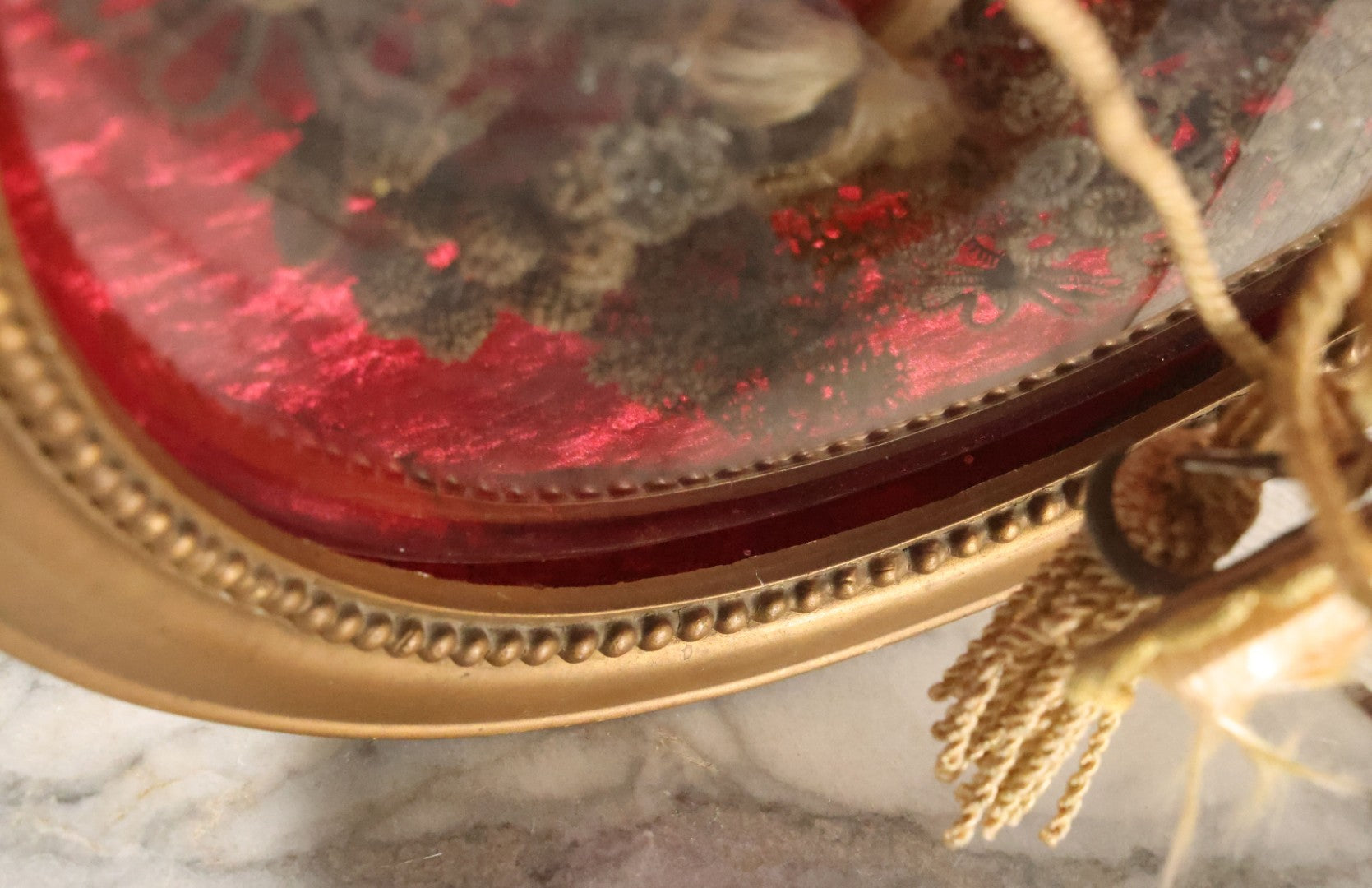 Lot 008 - Antique Victorian Human Hair Work Wreath In Oval Shadow Box With Bubble Glass, Refurbished Faux Red Velvet Back And Surround, 16" x 22"