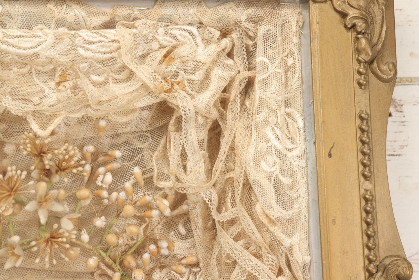 Lot 009 - Antique Victorian Wedding Commemoration Shadow Box With Lace Wedding Veil, Faux Floral Adornments, Cabinet Card Photograph Of Couple At Center, In Gesso Frame, 20-1/2" x 24-1/2" x 3-3/4"
