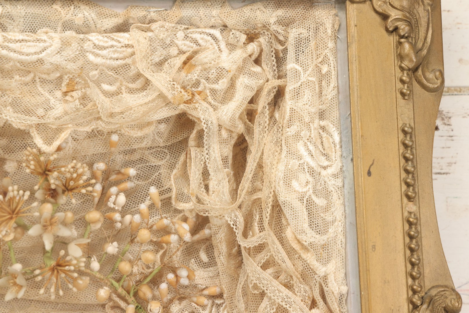 Lot 009 - Antique Victorian Wedding Commemoration Shadow Box With Lace Wedding Veil, Faux Floral Adornments, Cabinet Card Photograph Of Couple At Center, In Gesso Frame, 20-1/2" x 24-1/2" x 3-3/4"