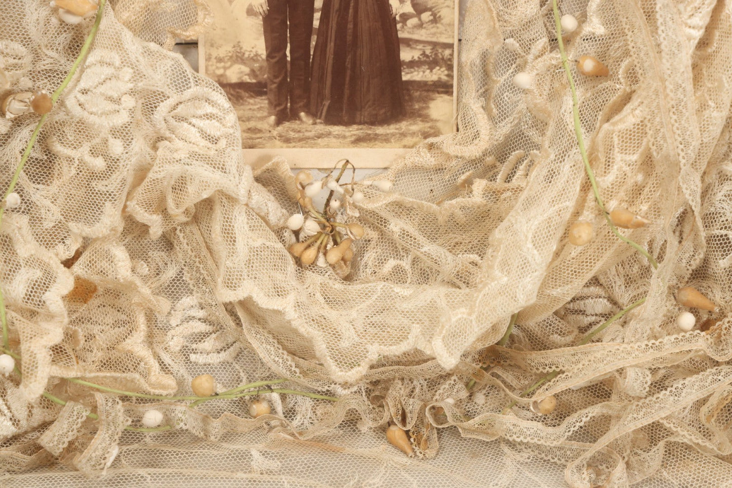 Lot 009 - Antique Victorian Wedding Commemoration Shadow Box With Lace Wedding Veil, Faux Floral Adornments, Cabinet Card Photograph Of Couple At Center, In Gesso Frame, 20-1/2" x 24-1/2" x 3-3/4"