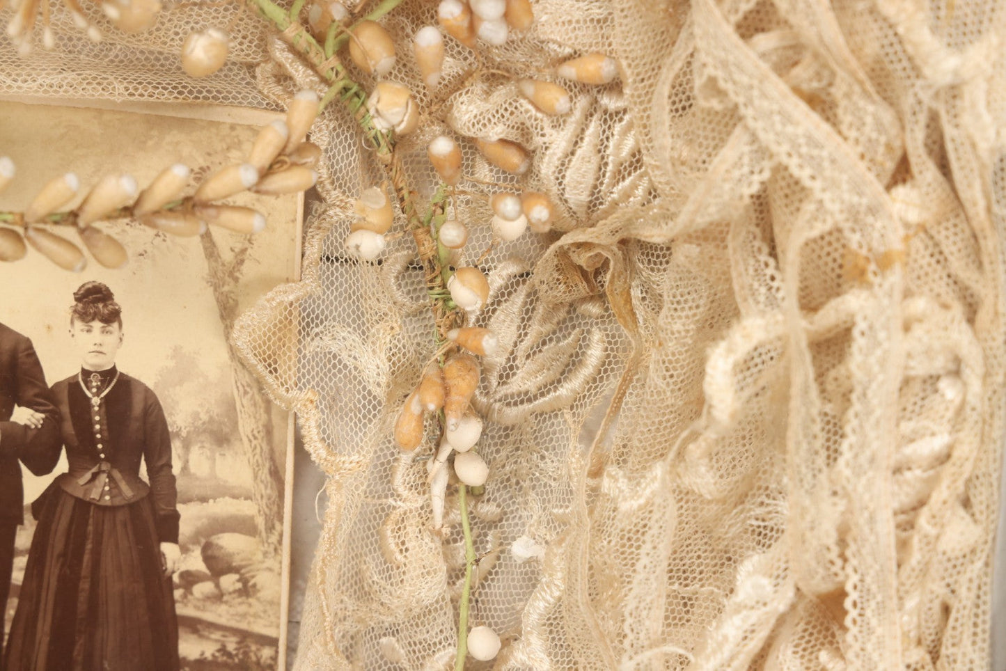 Lot 009 - Antique Victorian Wedding Commemoration Shadow Box With Lace Wedding Veil, Faux Floral Adornments, Cabinet Card Photograph Of Couple At Center, In Gesso Frame, 20-1/2" x 24-1/2" x 3-3/4"