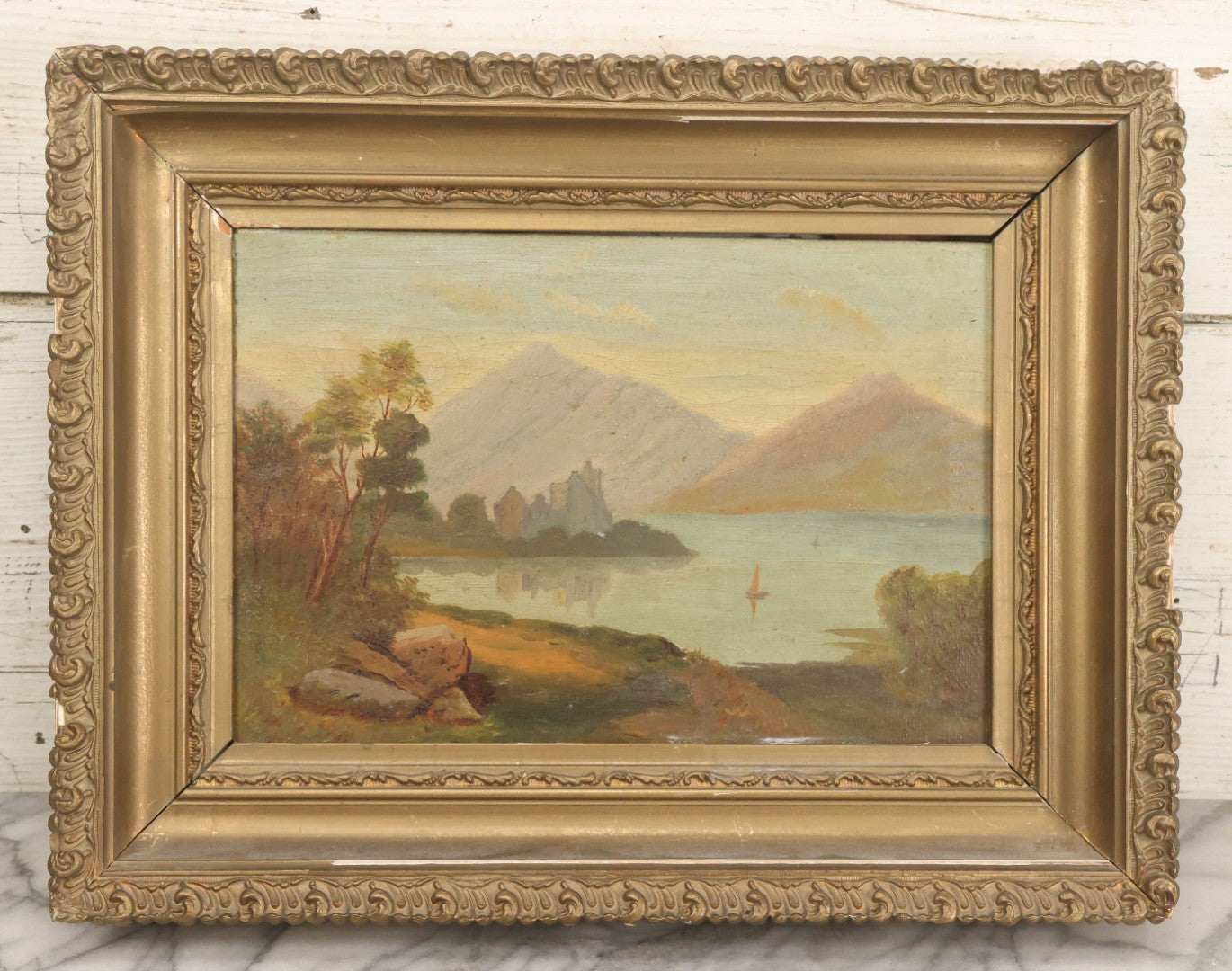 Lot 014 - Antique Oil On Canvas Painting Of A Mountainside Lake Scene With Sailboats, Building At Foot Of Mountain, Likely European, Unsigned, Circa  Mid 19th Century, 17" x 13"