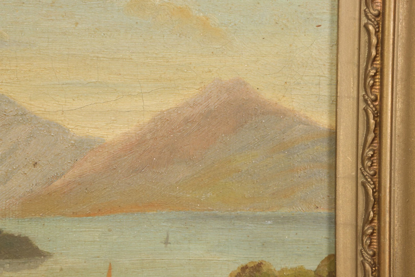 Lot 014 - Antique Oil On Canvas Painting Of A Mountainside Lake Scene With Sailboats, Building At Foot Of Mountain, Likely European, Unsigned, Circa  Mid 19th Century, 17" x 13"