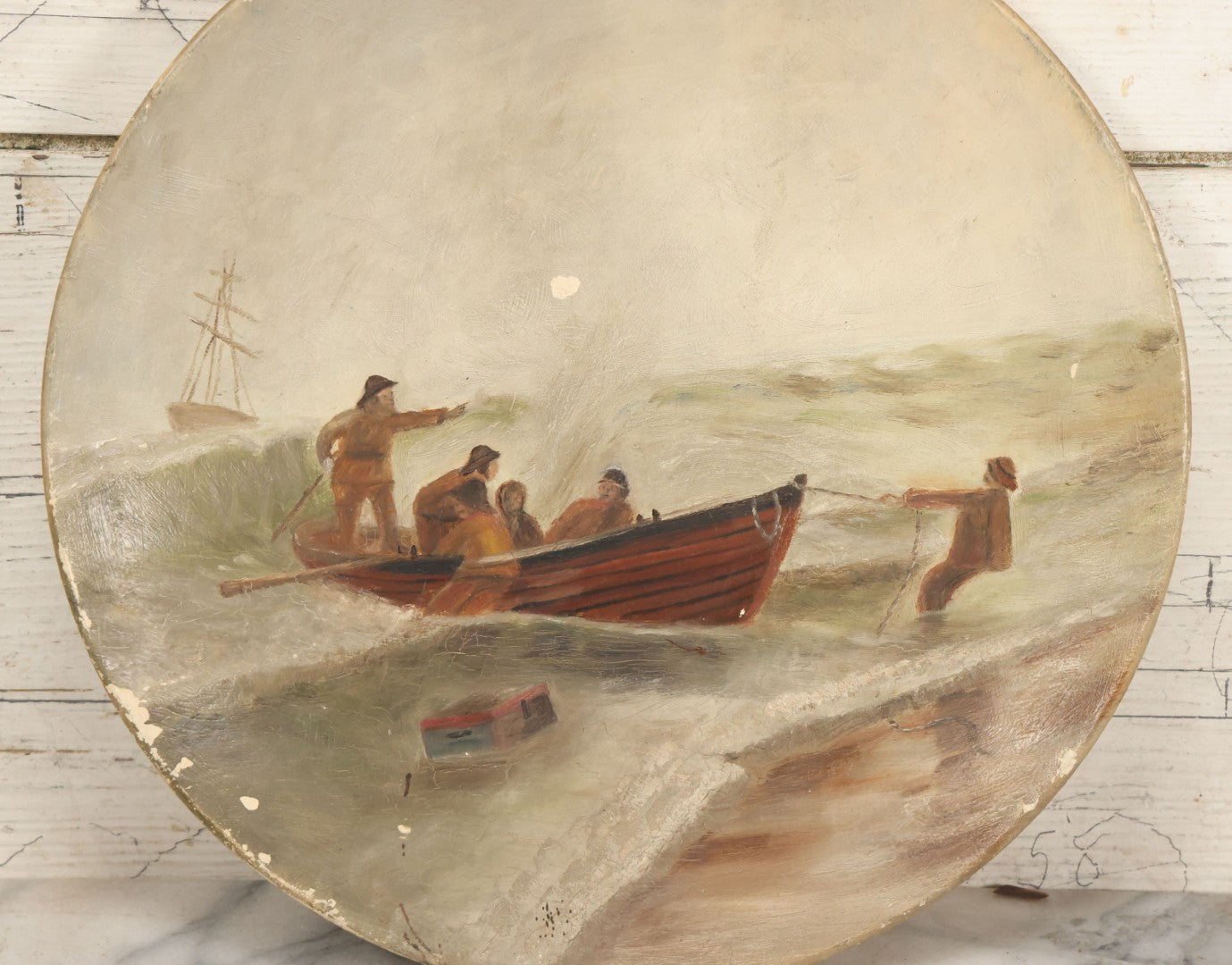 Lot 015 - Antique Painting On Composition Charger, Nautical Scene With Fishermen Arriving At Shore In Dinghy, Tall Ship In Distance, 12" Diameter, Paper Label On Verso, Circa 1880s Note Small Loss At Center Above Horizon