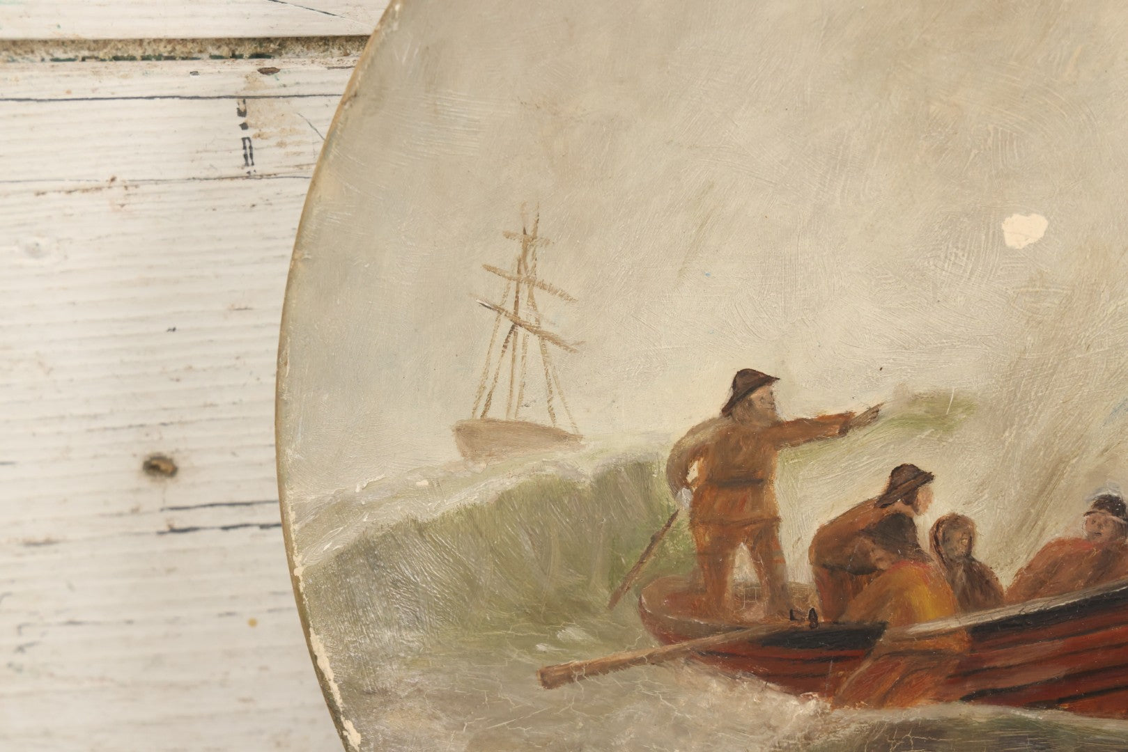 Lot 015 - Antique Painting On Composition Charger, Nautical Scene With Fishermen Arriving At Shore In Dinghy, Tall Ship In Distance, 12" Diameter, Paper Label On Verso, Circa 1880s Note Small Loss At Center Above Horizon