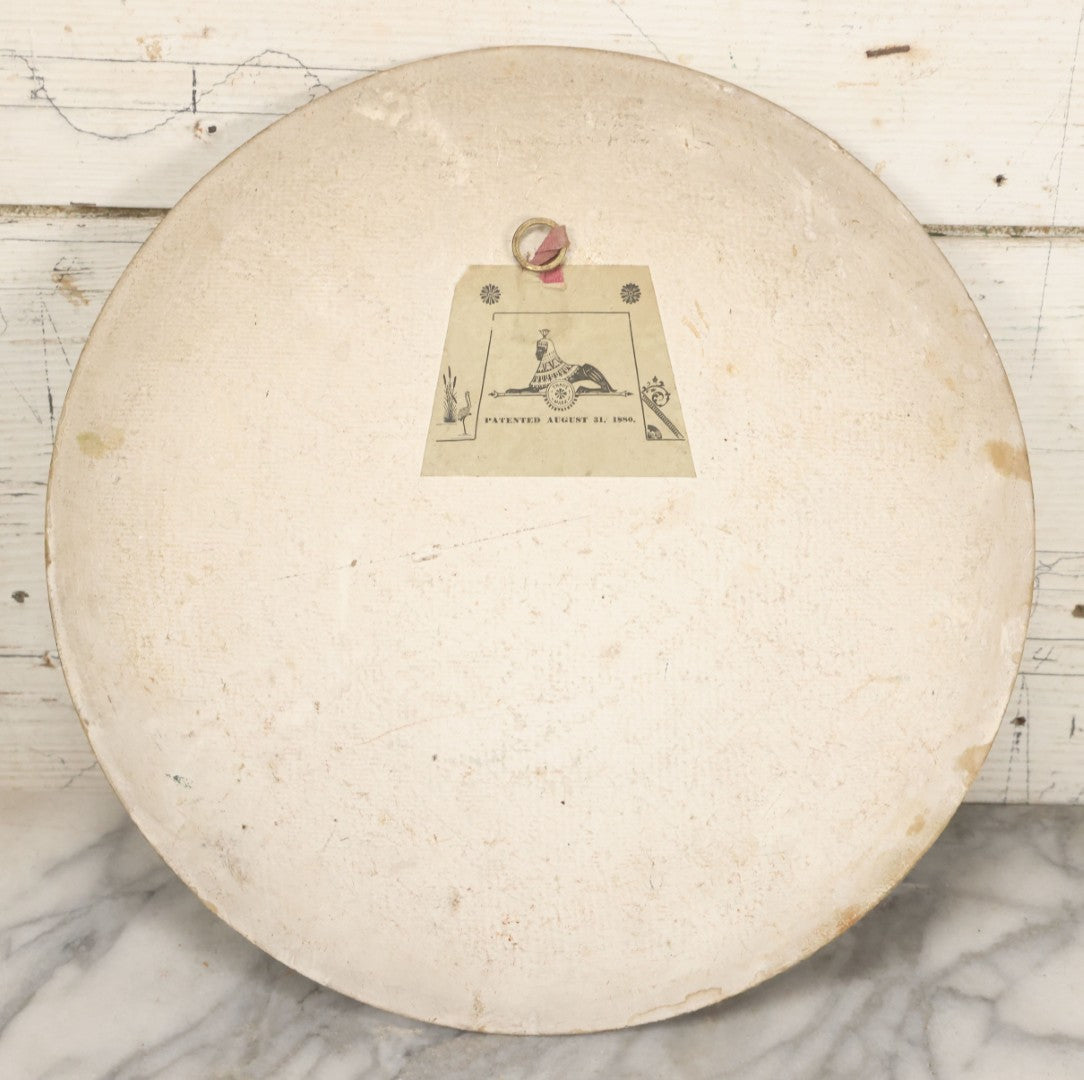 Lot 015 - Antique Painting On Composition Charger, Nautical Scene With Fishermen Arriving At Shore In Dinghy, Tall Ship In Distance, 12" Diameter, Paper Label On Verso, Circa 1880s Note Small Loss At Center Above Horizon