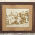 Lot 019 - Antique Boarded Photograph In Frame Of "The Steamboat Gang Of The New York," 1915, Occupational Photo Of Navy Sailors On Dock, With Tools Of The Trade, Other Workers In Background, U.S.S. New York (BB-34), 15-1/2" x 13-1/2"