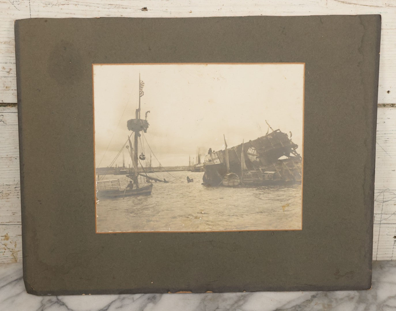 Lot 022 - Antique Boarded Photograph Of The Aftermath Of The Sinking Of The U.S.S. Maine, Havana Harbor, Cuba, 1898, Event That Sparked The Spanish-American War, 17" x 13-1/4"