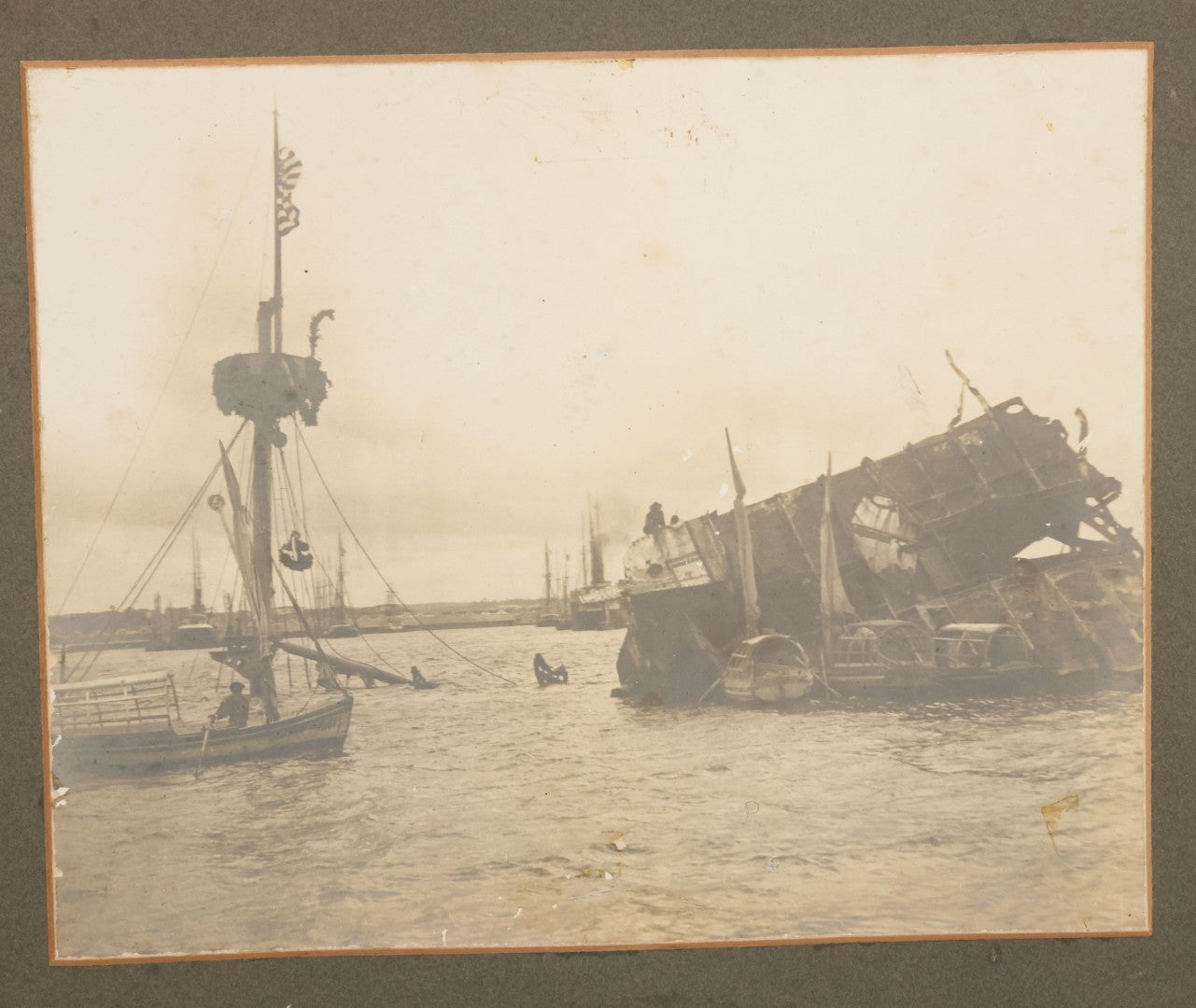Lot 022 - Antique Boarded Photograph Of The Aftermath Of The Sinking Of The U.S.S. Maine, Havana Harbor, Cuba, 1898, Event That Sparked The Spanish-American War, 17" x 13-1/4"
