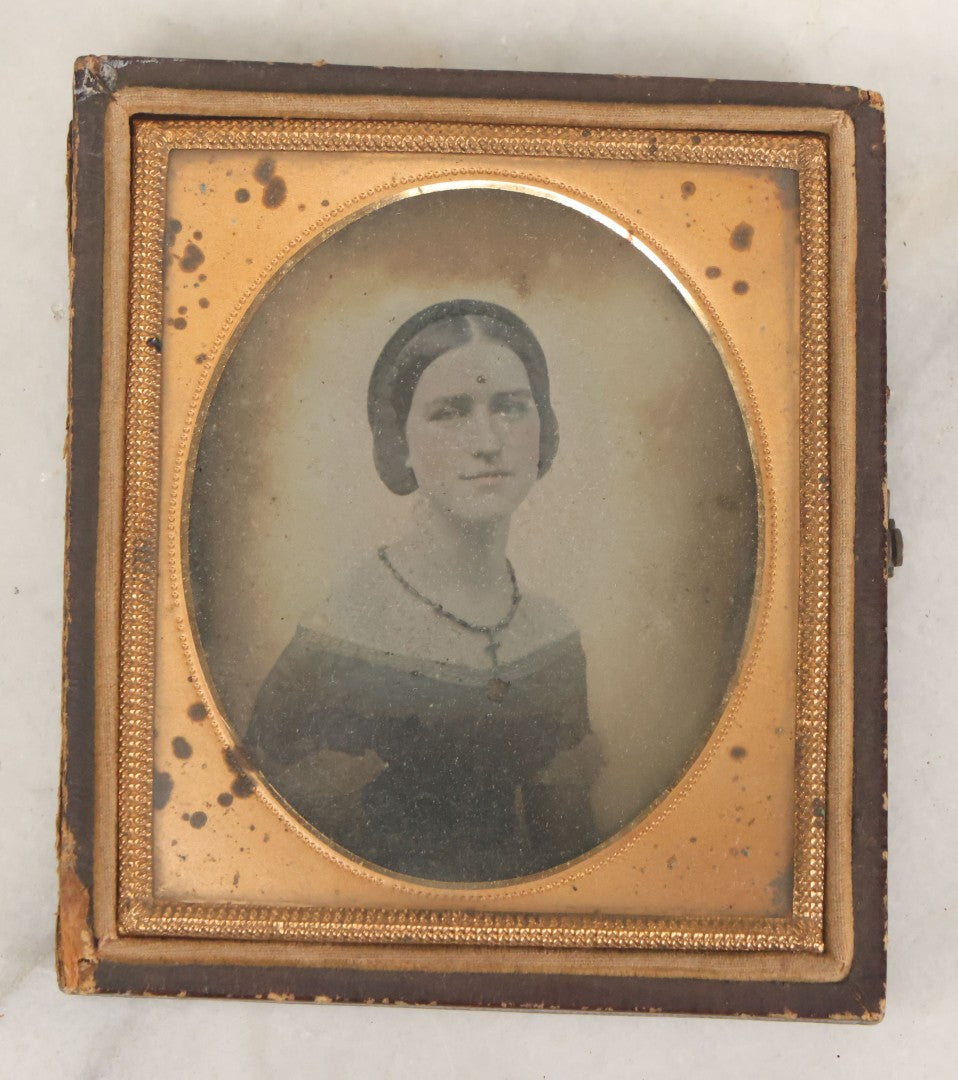 Lot 029 - Antique 1/6th Plate Ambrotype Photograph Of A Young Woman Identified Only As "Beautiful" With Handwritten Note On Verso, In Half Leatherette Union Case, With Faint Tinting