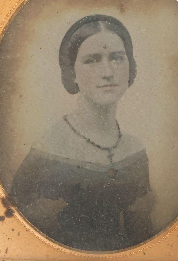 Lot 029 - Antique 1/6th Plate Ambrotype Photograph Of A Young Woman Identified Only As "Beautiful" With Handwritten Note On Verso, In Half Leatherette Union Case, With Faint Tinting