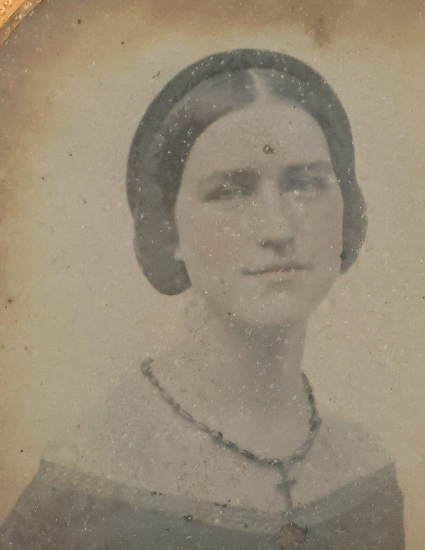 Lot 029 - Antique 1/6th Plate Ambrotype Photograph Of A Young Woman Identified Only As "Beautiful" With Handwritten Note On Verso, In Half Leatherette Union Case, With Faint Tinting