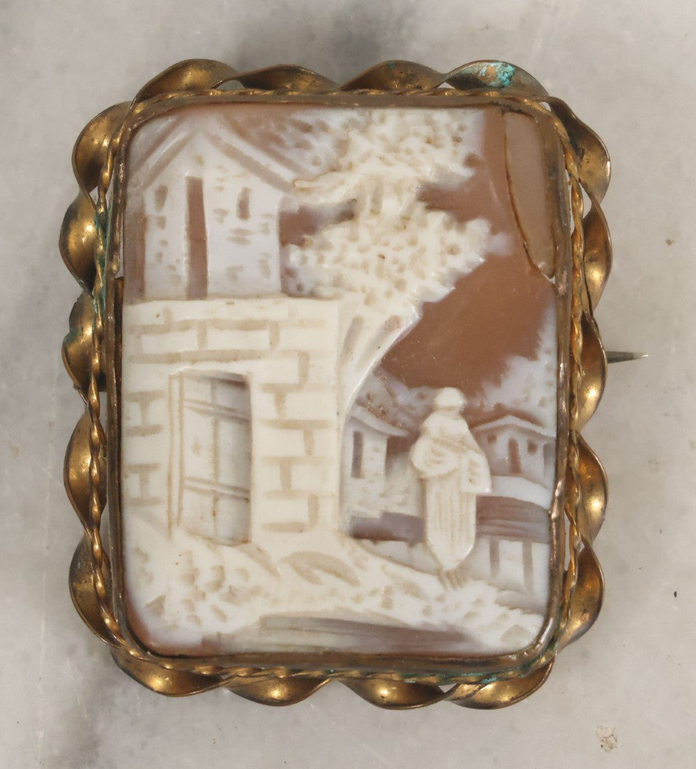 Lot 038 - Antique Shell Cameo Brooch Pin With A Scene Of A Woman Walking Beside A Stone Building, Village With Trees, Note Crack Upper Right, Missing Pin Stay