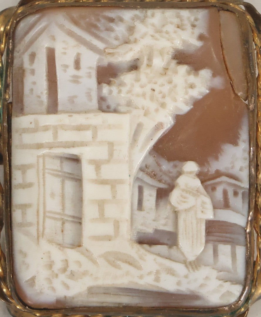 Lot 038 - Antique Shell Cameo Brooch Pin With A Scene Of A Woman Walking Beside A Stone Building, Village With Trees, Note Crack Upper Right, Missing Pin Stay