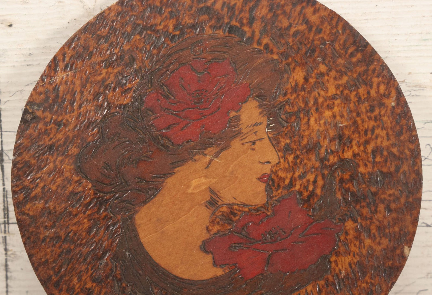 Lot 047 - Antique Flemish Art Pyrography Wood Burned Wall Hanger Disc With "Gibson Girl" Style Woman With Red Lipstick, Flowers, 7-3/4" Diameter