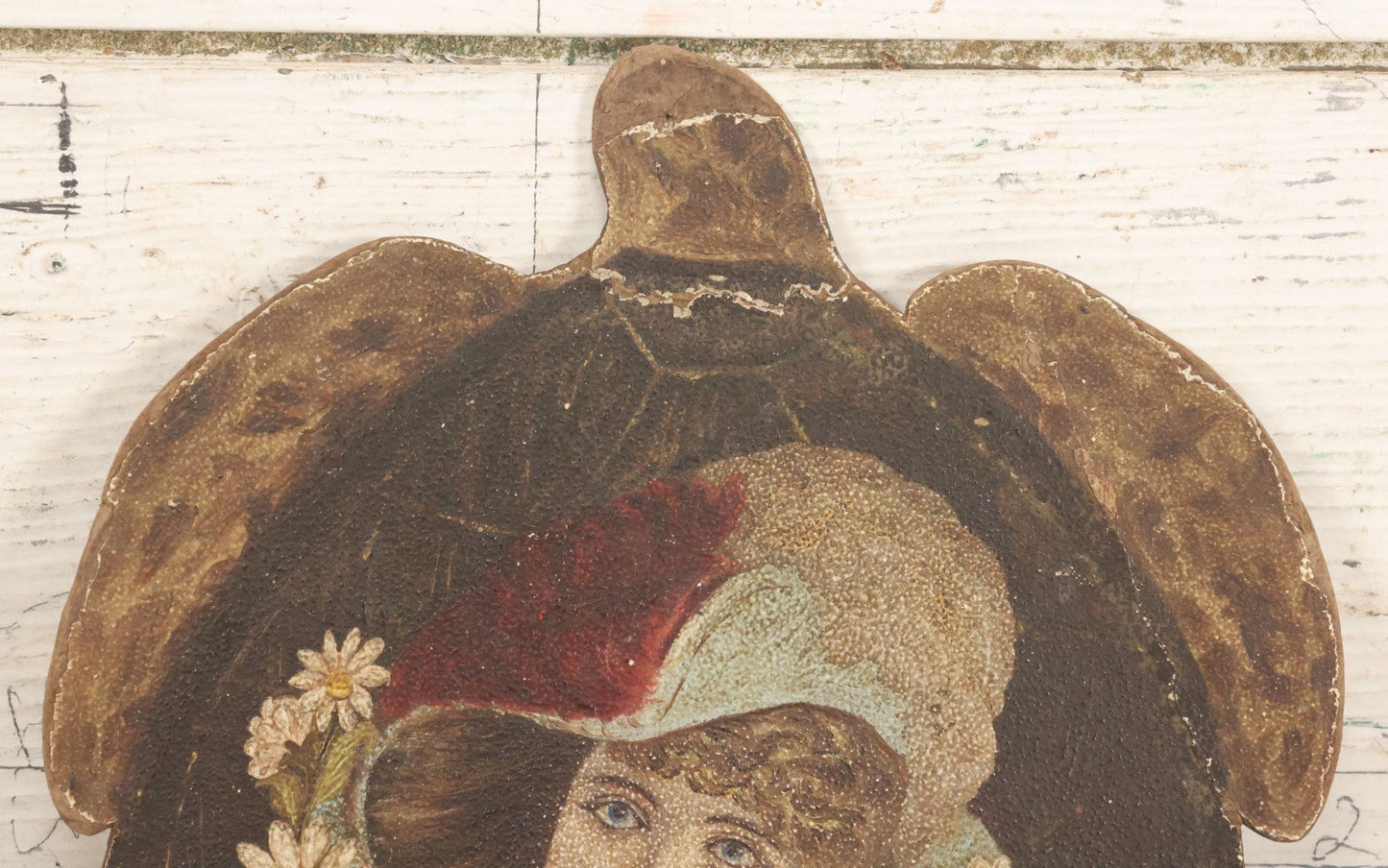 Lot 048 - Antique Hand Painted Die Cut Turtle Painting Board With Image Of A Woman In A Hat Surrounded By Daisies, Note Wear To Turtle's Neck