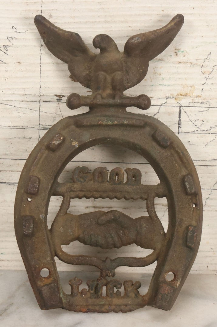 Lot 053 - Antique Cast Iron Horseshoe With Shaking Hands Motif, Eagle, "Good Luck," With Wall Mounting Holes