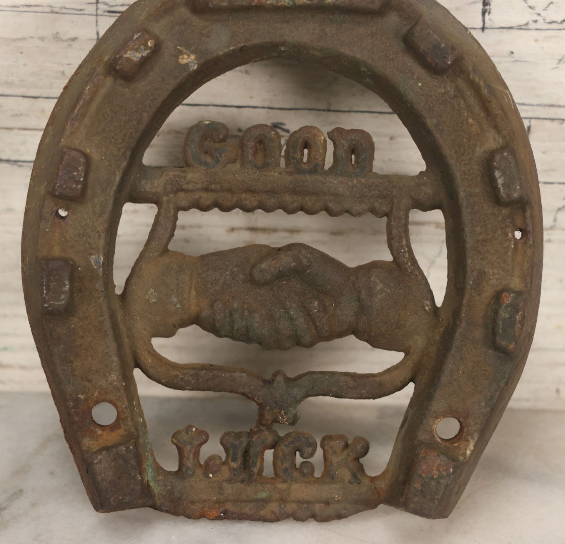 Lot 053 - Antique Cast Iron Horseshoe With Shaking Hands Motif, Eagle, "Good Luck," With Wall Mounting Holes