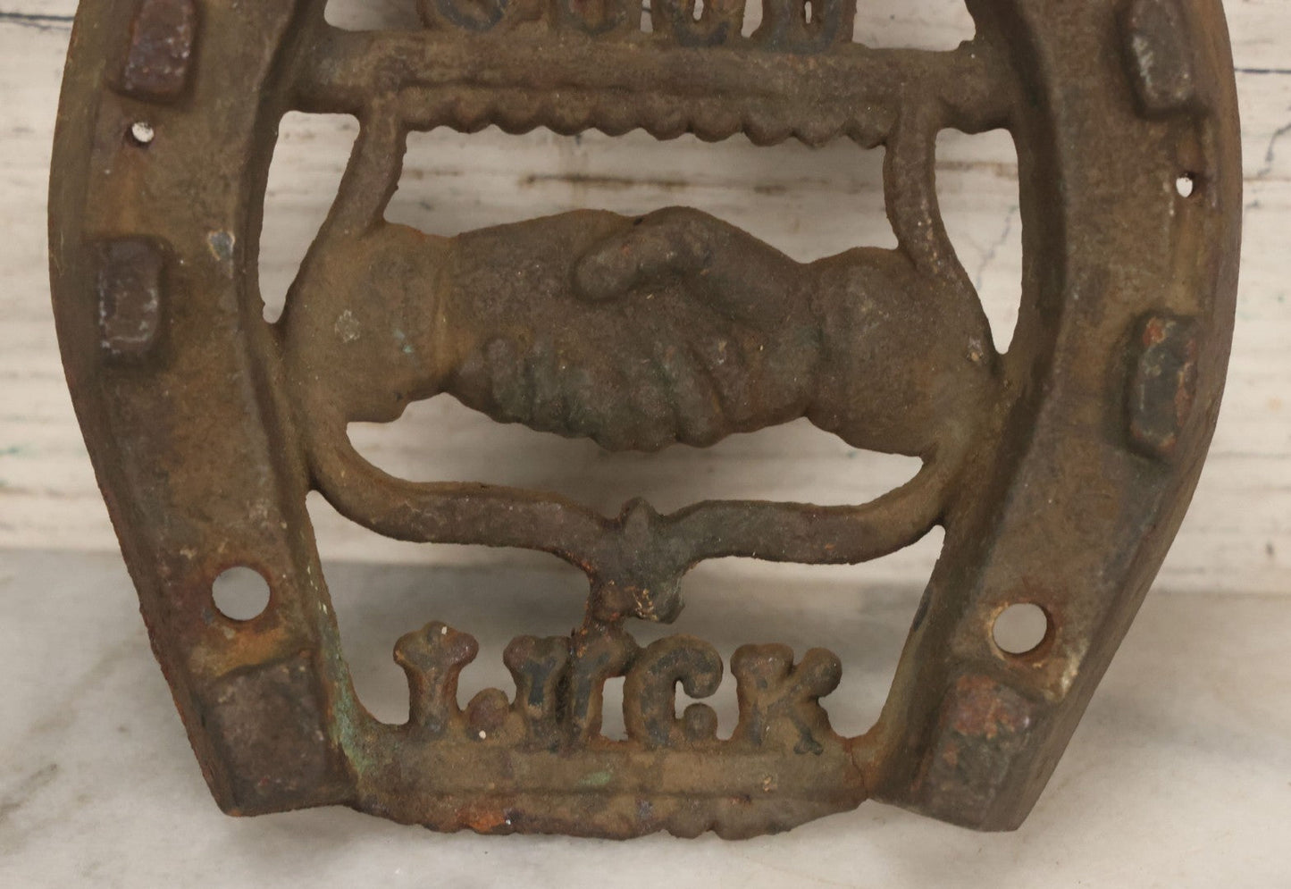 Lot 053 - Antique Cast Iron Horseshoe With Shaking Hands Motif, Eagle, "Good Luck," With Wall Mounting Holes